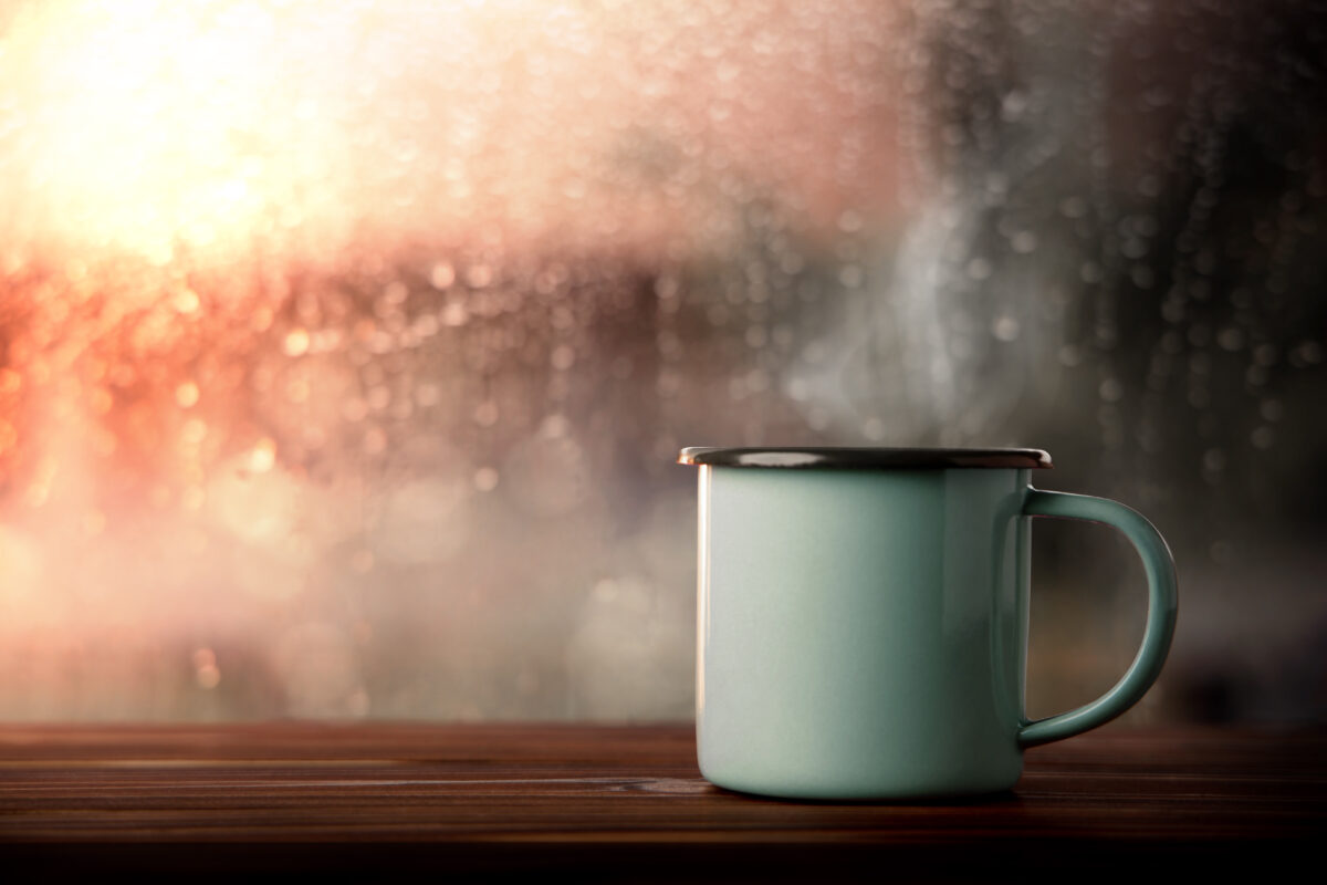 Morning Drink on Rainy Day. Hot Coffee Cup by Glass Window in House. Happiness, Calm or Relaxing Mind on Rainy Day