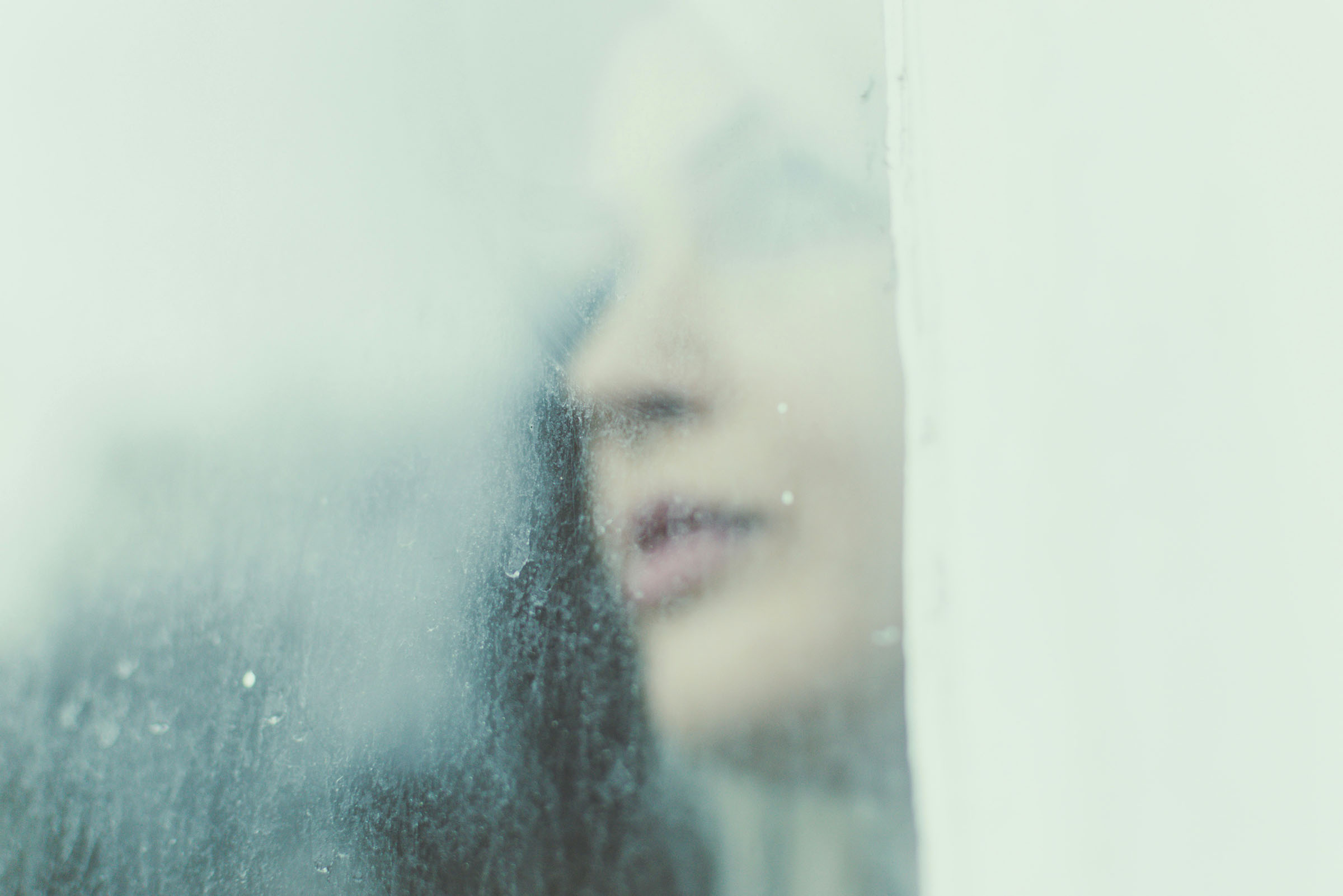 Woman looking out window